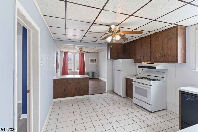 36 Edison Street Bloomfield, NJ 07003 - Photo 5 of 28 a kitchen with a stove a refrigerator and a sink