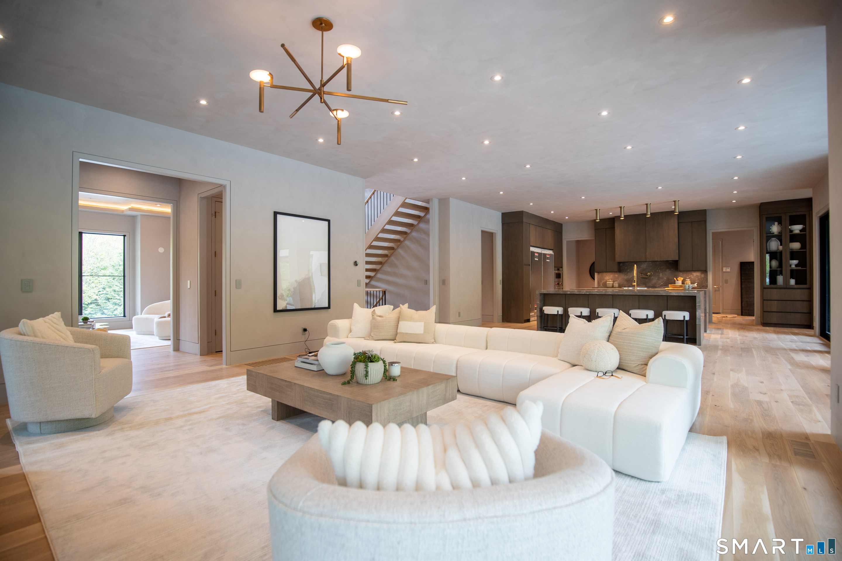 259 Frogtown Road New Canaan, CT 06840 - Photo 12 of 39 A family room for the entire family and friends, with sliders to the pool and a bonus covered porch with a fireplace