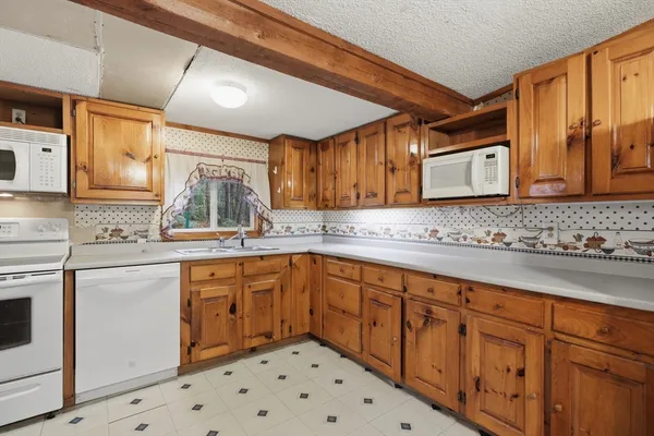 a kitchen with sink cabinets and window