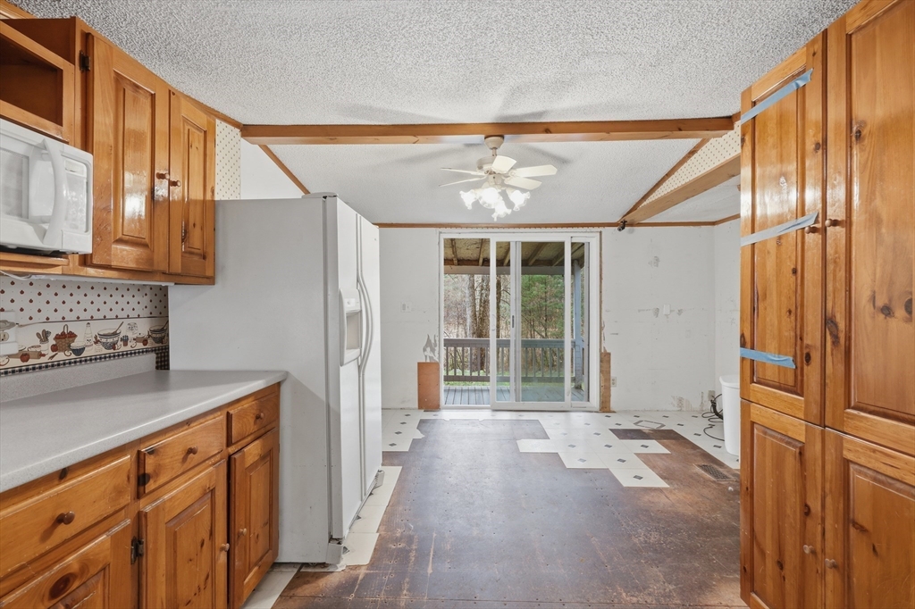 987 Patriots Road Templeton, MA 01468 - Photo 17 of 39 a view of hallway with wooden floor and cabinet