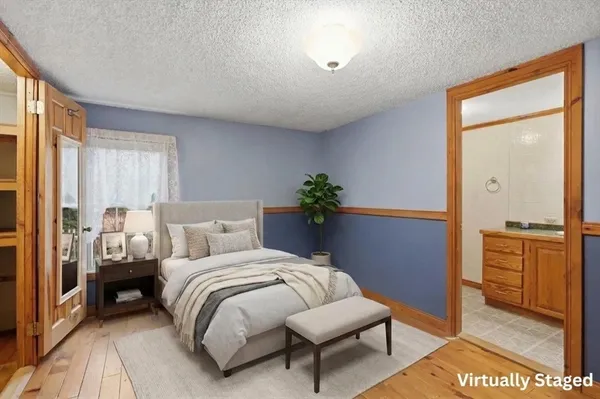 a bedroom with a bed and a dresser
