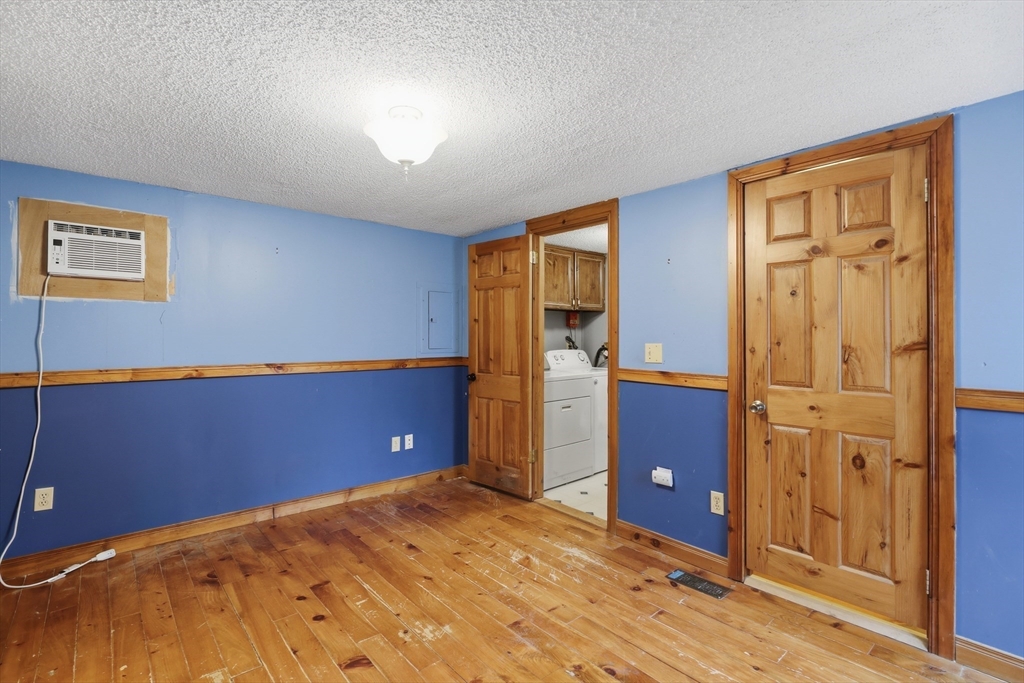 987 Patriots Road Templeton, MA 01468 - Photo 20 of 39 a view of a kitchen with refrigerator and wooden floor