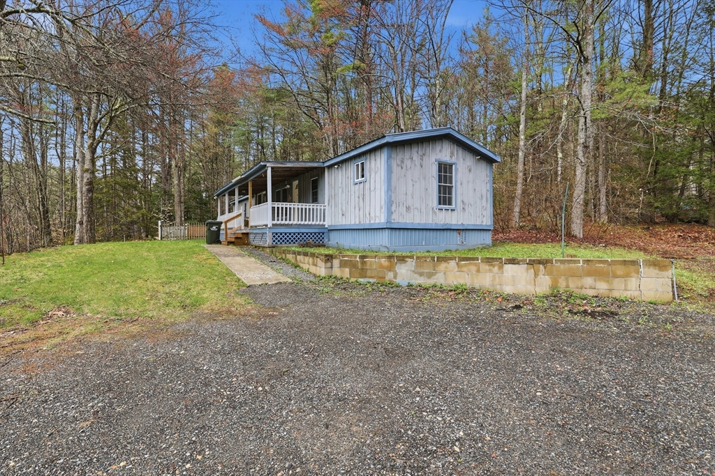 987 Patriots Road Templeton, MA 01468 - Photo 2 of 39 a house view with a outdoor space