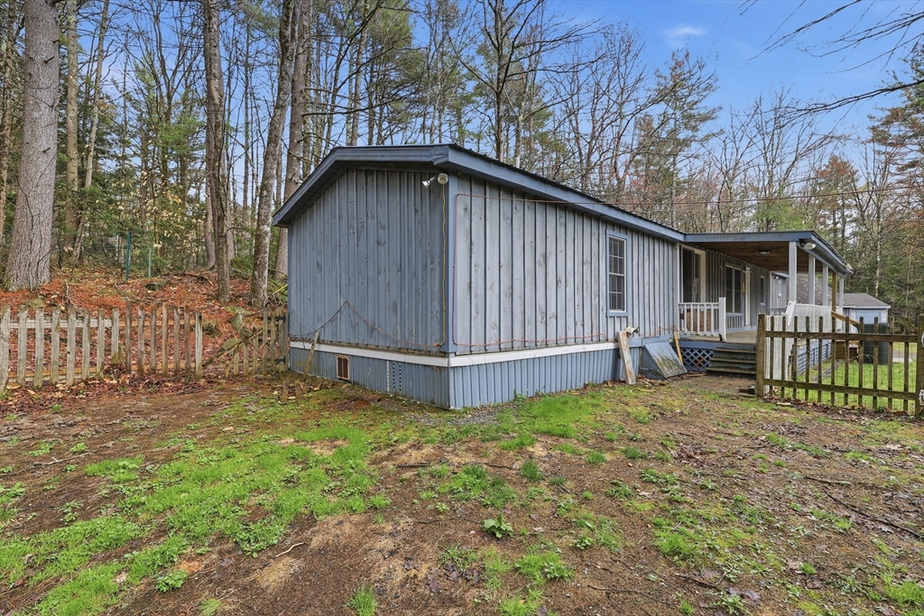 987 Patriots Road Templeton, MA 01468 - Photo 31 of 39 a view of a house with a yard and fence