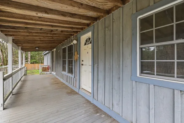 a view of porch with wooden floor