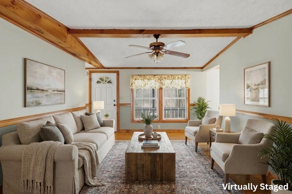 987 Patriots Road Templeton, MA 01468 - Photo 8 of 39 a living room with furniture and a large window