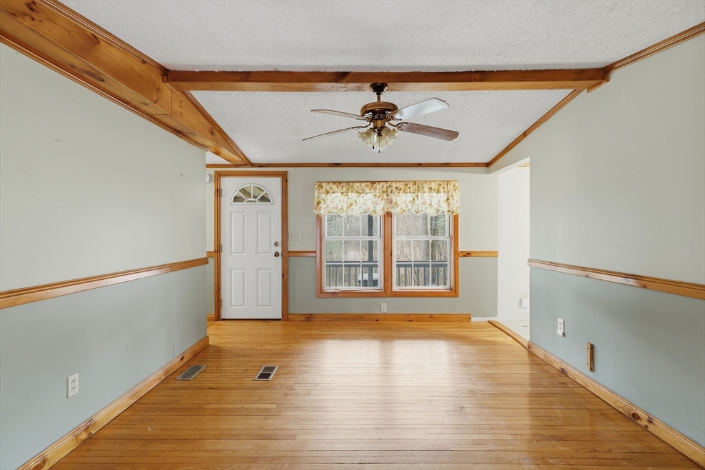 987 Patriots Road Templeton, MA 01468 - Photo 10 of 39 a view of an empty room with a window