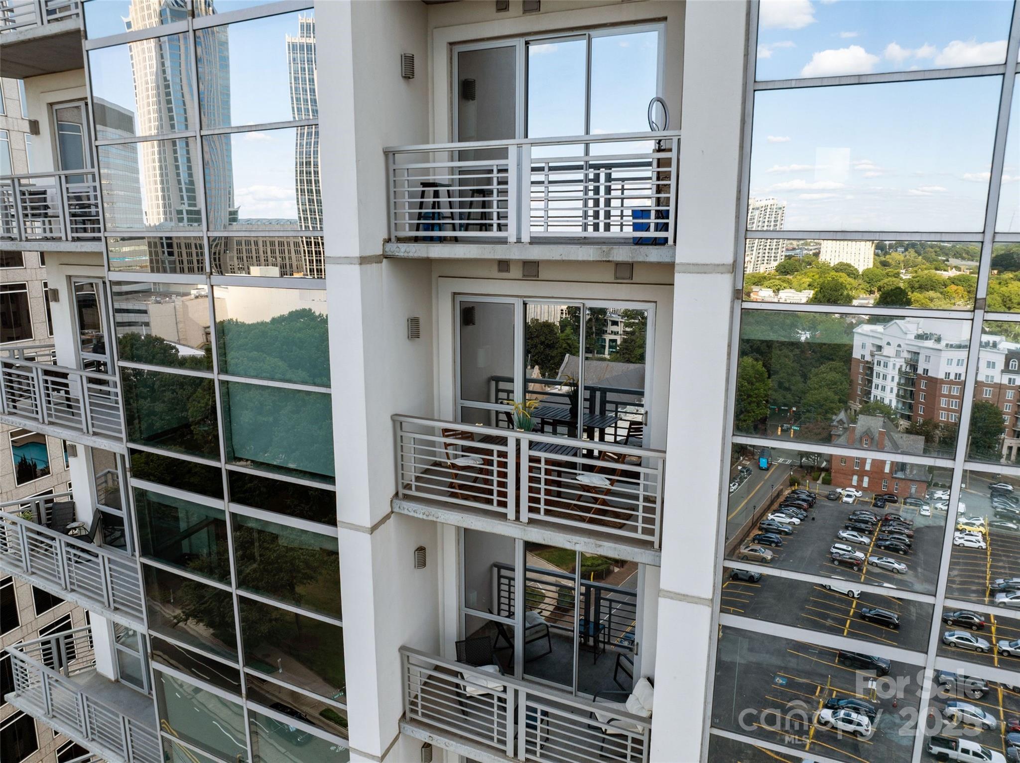 333 West Trade Street, Unit 1301 Charlotte, NC 28202 - Photo 12 of 34 a front view of a building with glass windows