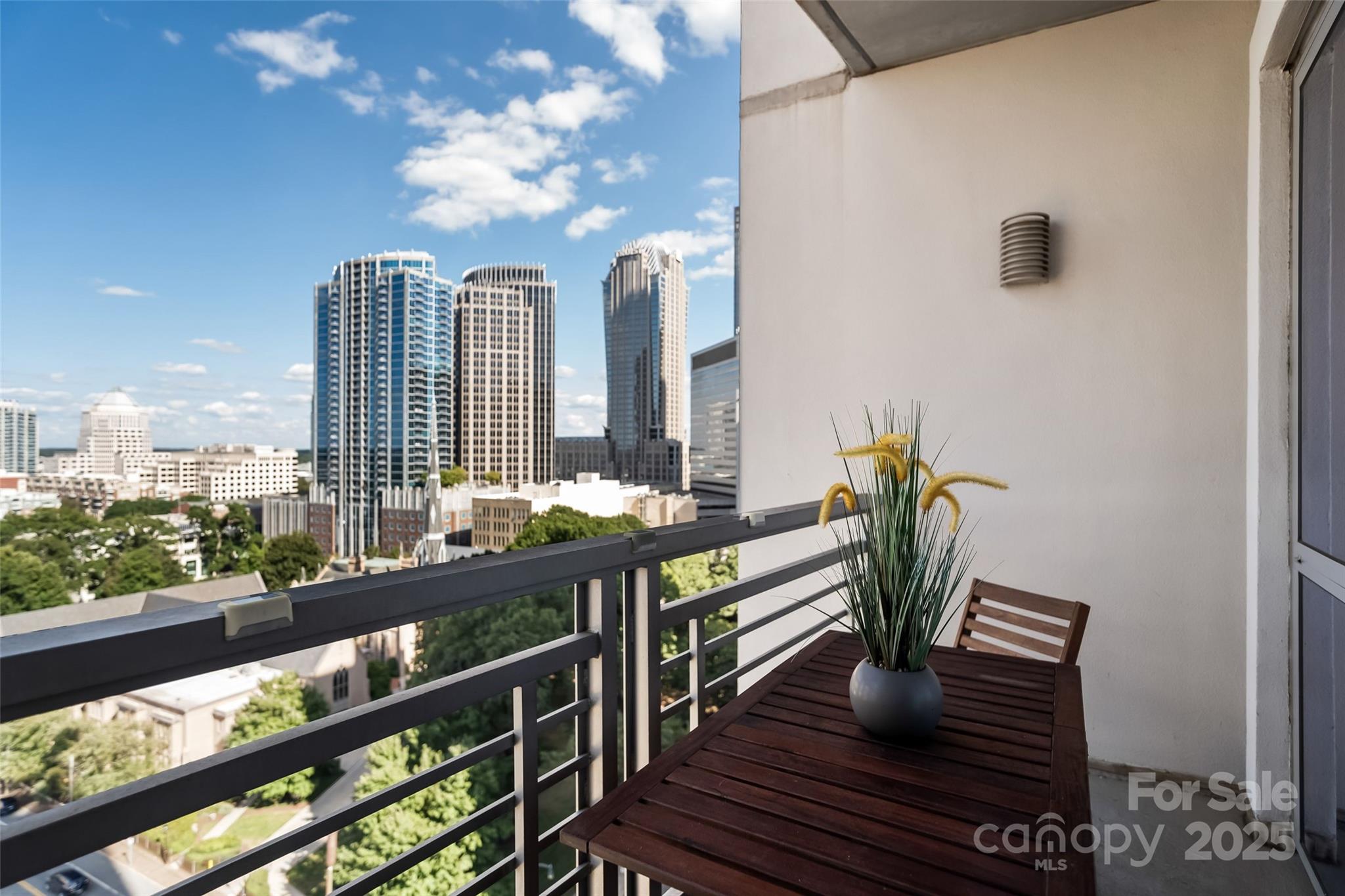 333 West Trade Street, Unit 1301 Charlotte, NC 28202 - Photo 13 of 34 a view of a balcony with chairs