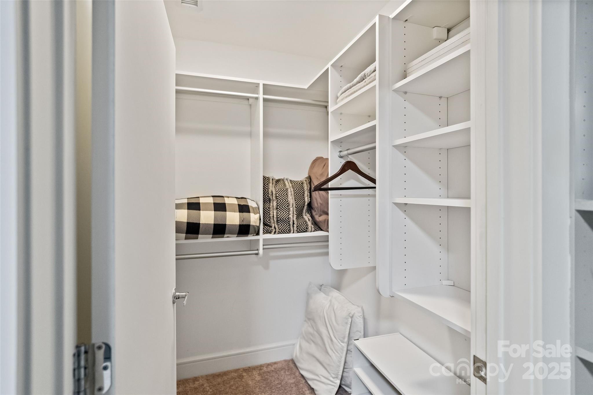 333 West Trade Street, Unit 1301 Charlotte, NC 28202 - Photo 23 of 34 a view of a room with rack on the wall