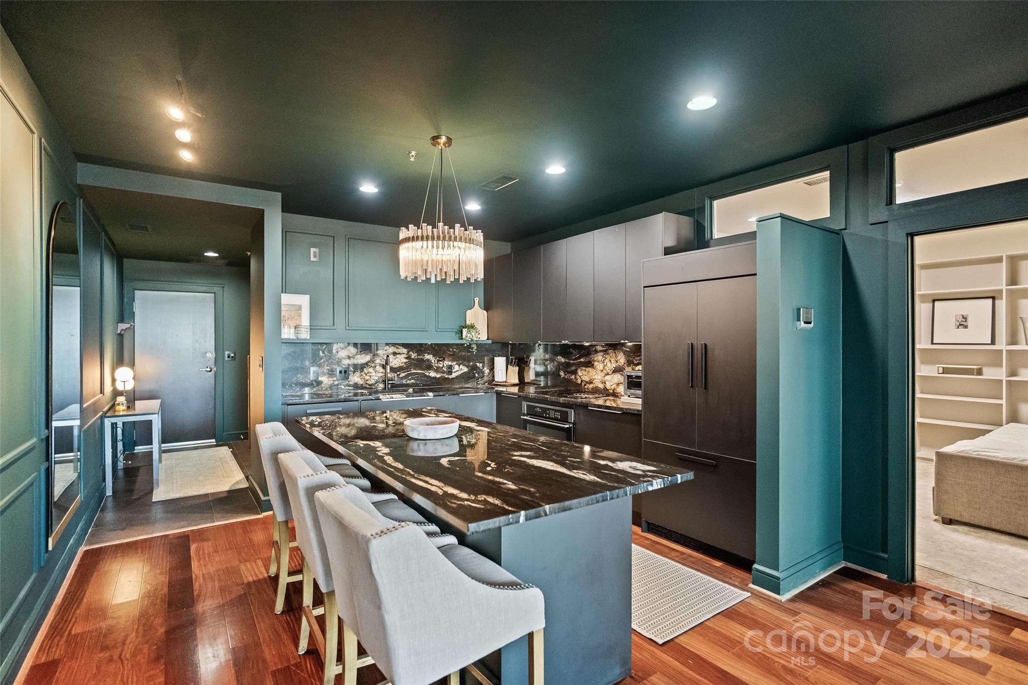 333 West Trade Street, Unit 1301 Charlotte, NC 28202 - Photo 5 of 34 a kitchen with stainless steel appliances granite countertop a stove and a refrigerator
