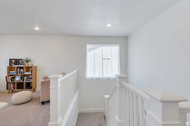 2664 West Maple Street Mapleton, UT 84664 - Photo 18 of 49 Upper-level landing featuring bright white walls, recessed lighting, and a window with a sheer covering