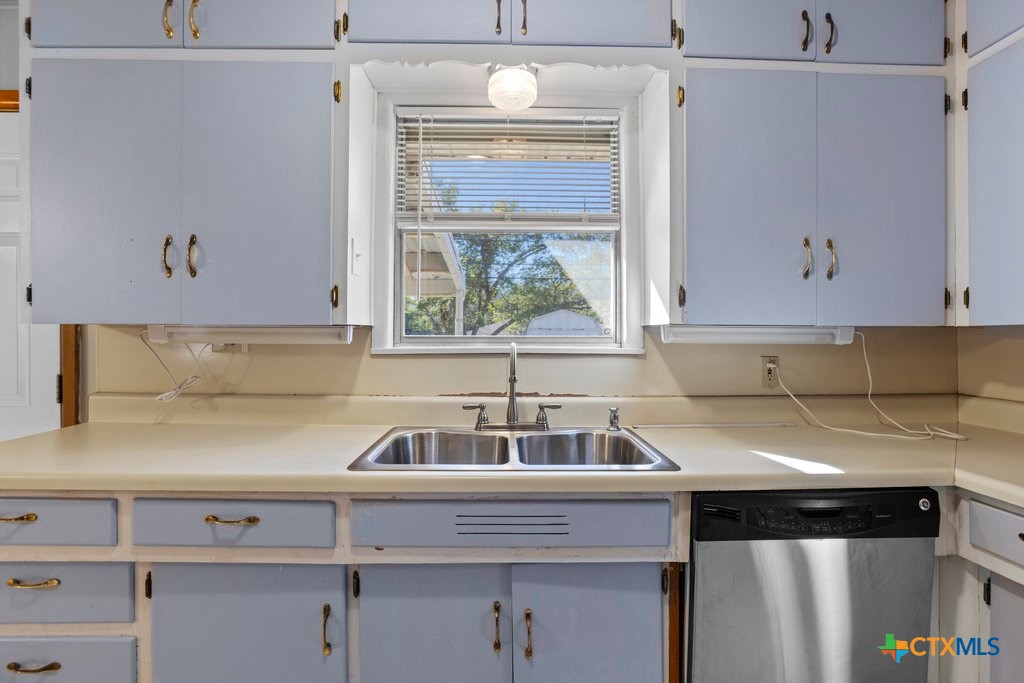 a kitchen with a sink and a cabinets