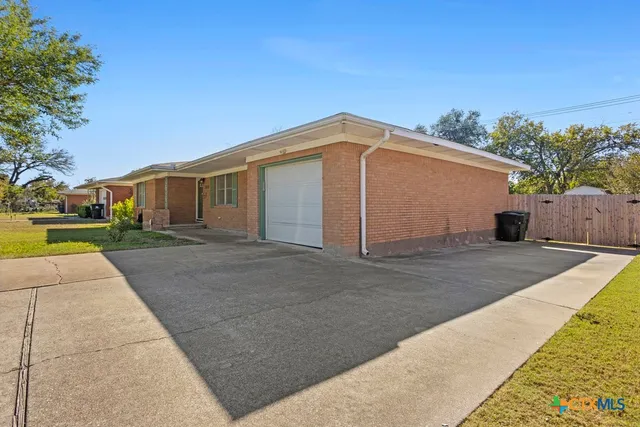a swimming pool with yard and outdoor seating