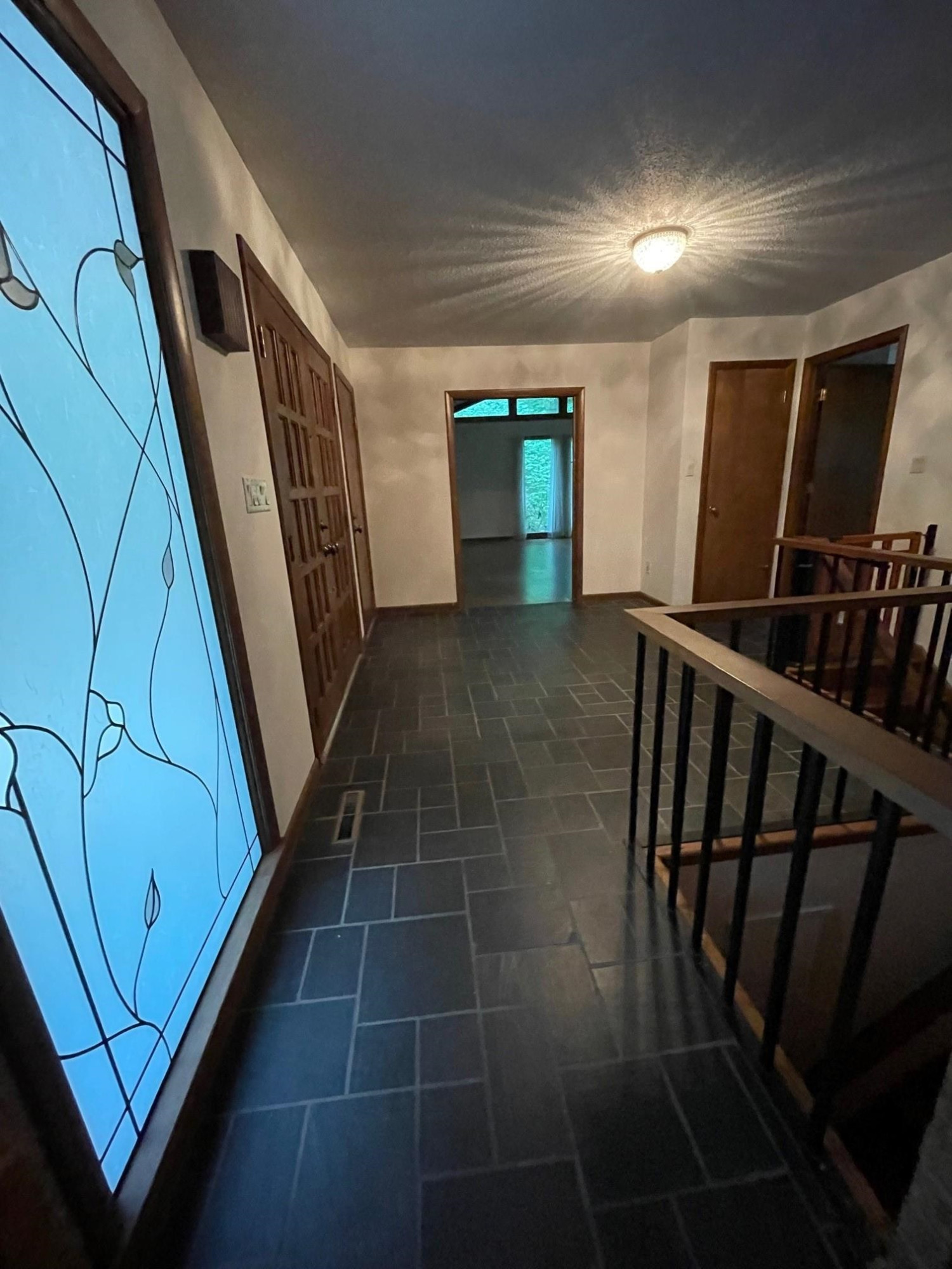 4815 Rembert Drive Raleigh, NC 27612 - Photo 5 of 26 ...has slate flooring and a beautiful leaded glass window Foyer