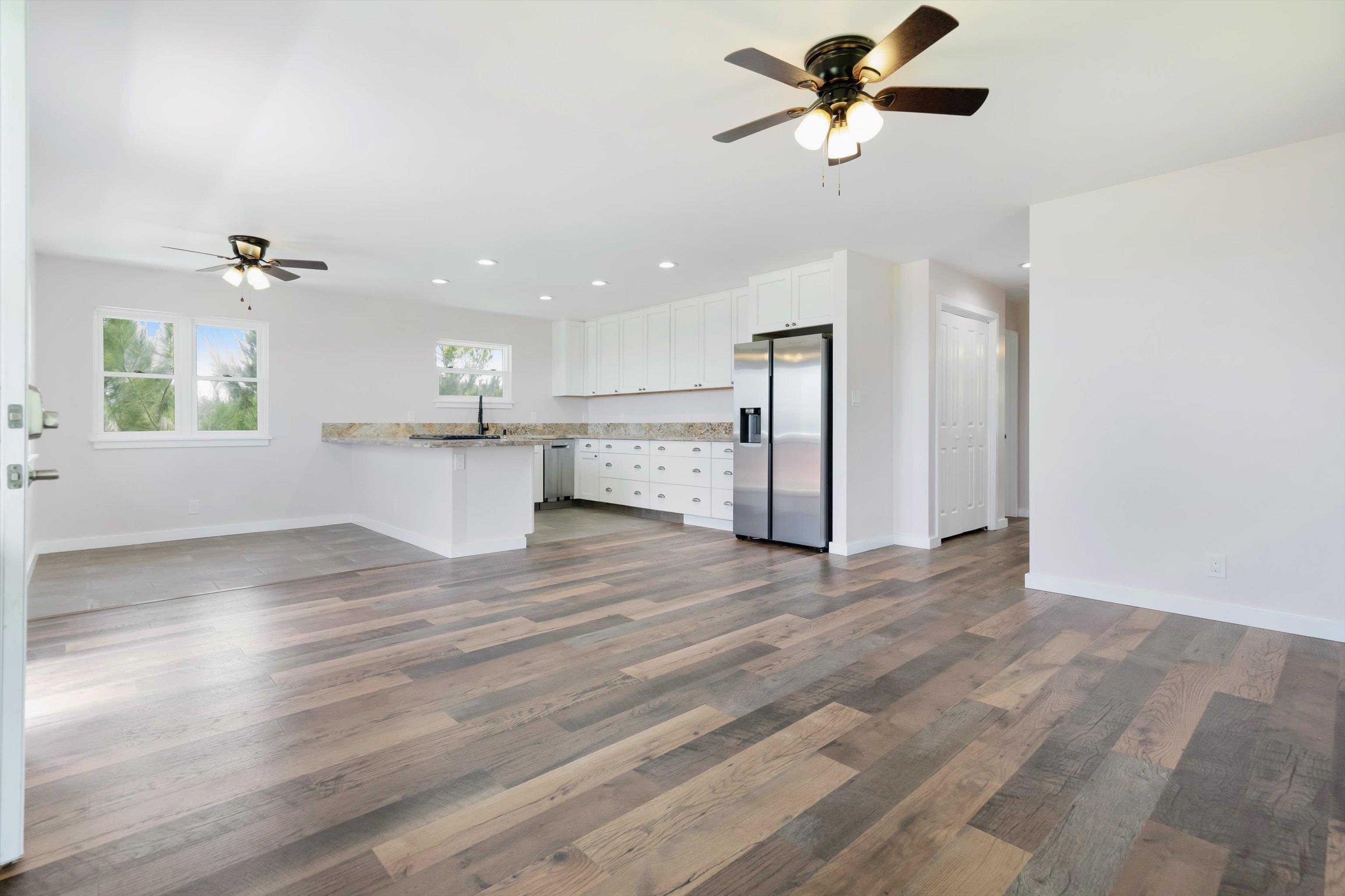 605 Kaupakalua Road Haiku, HI 96708 - Photo 12 of 44 a view of a kitchen with a sink cabinets and wooden floor