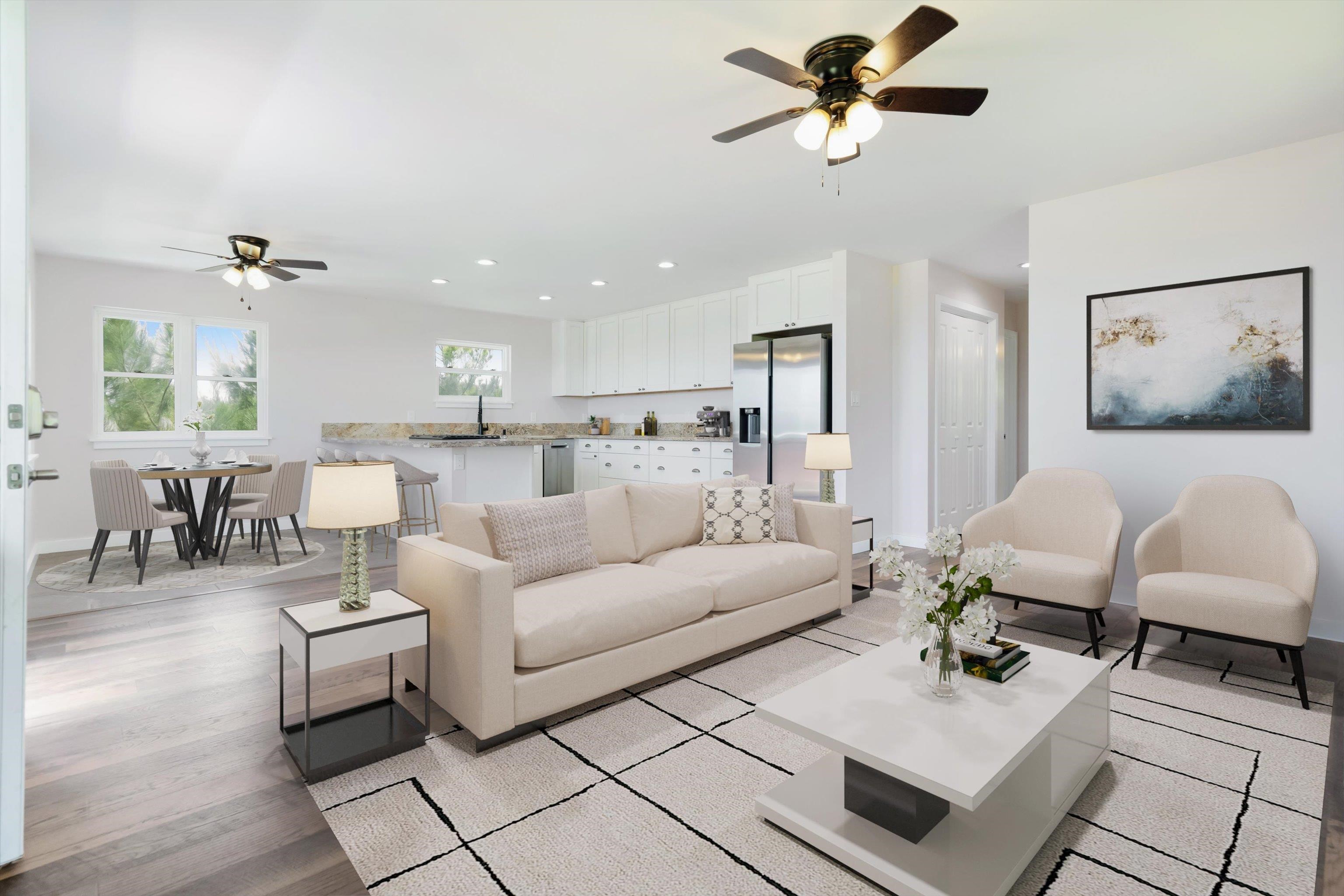 605 Kaupakalua Road Haiku, HI 96708 - Photo 13 of 44 a living room with furniture and a chandelier