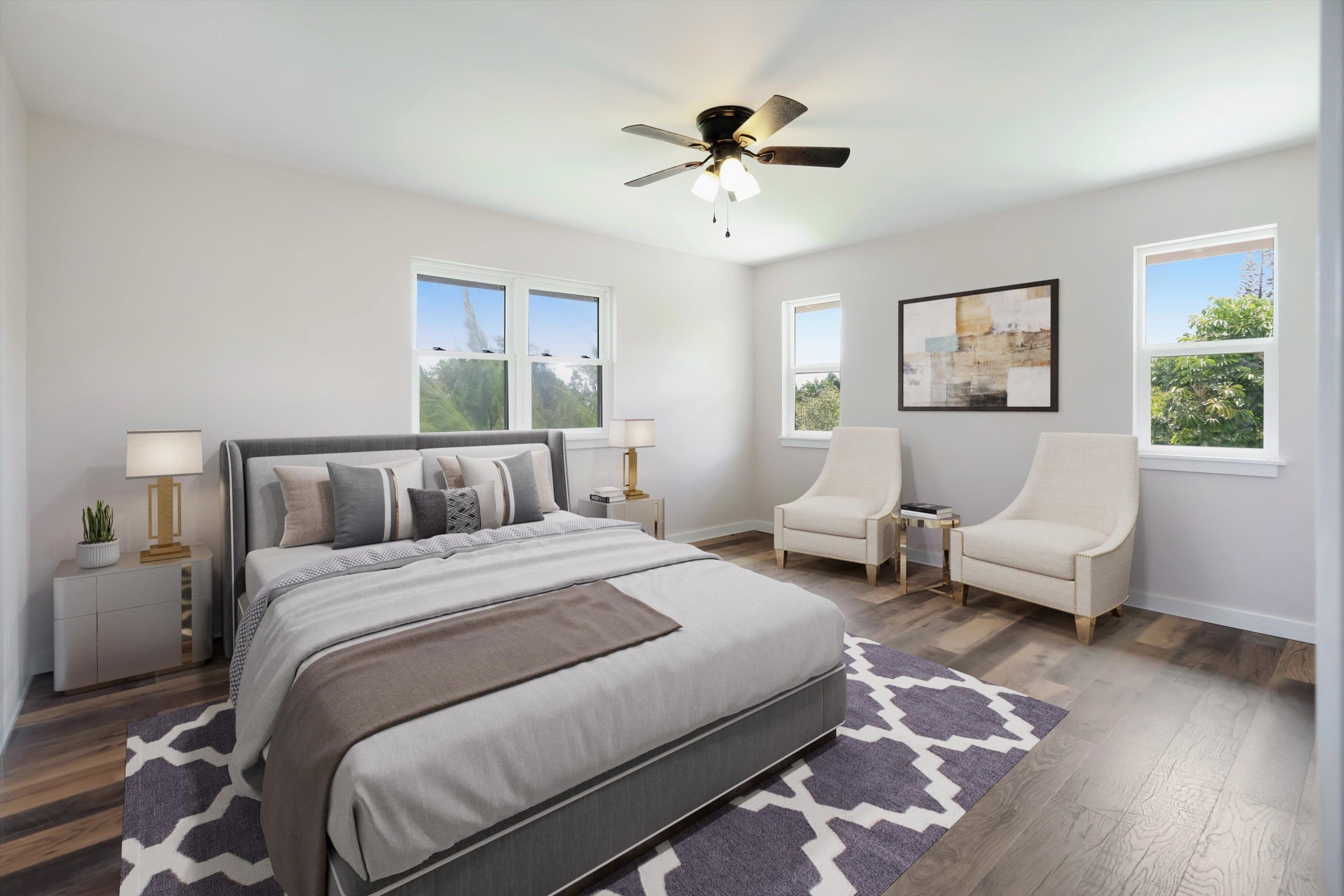 605 Kaupakalua Road Haiku, HI 96708 - Photo 18 of 44 a spacious bedroom with a bed and a chandelier