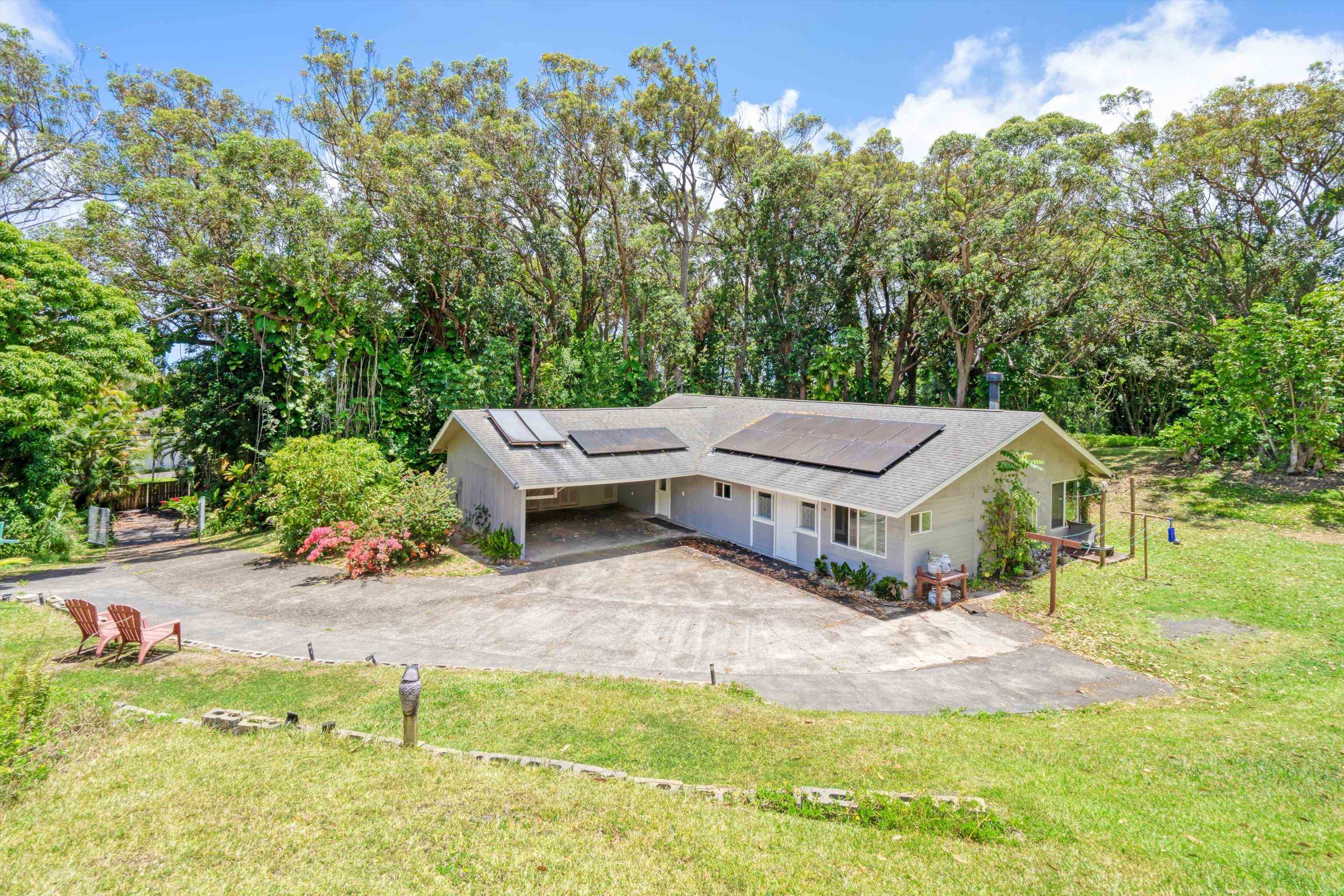 605 Kaupakalua Road Haiku, HI 96708 - Photo 29 of 44 a view of a house with a yard