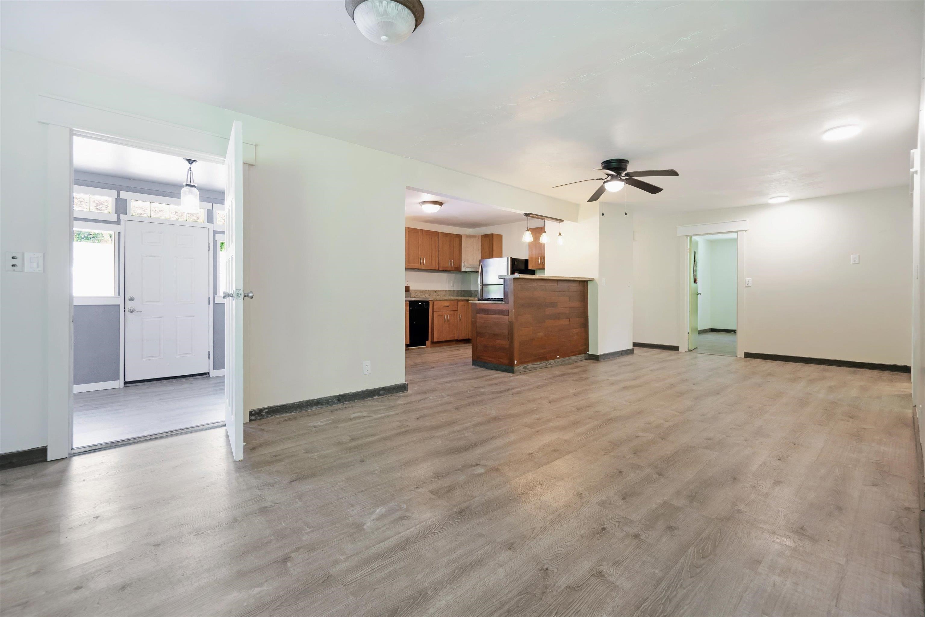 605 Kaupakalua Road Haiku, HI 96708 - Photo 32 of 44 a view of a livingroom with furniture and wooden floor