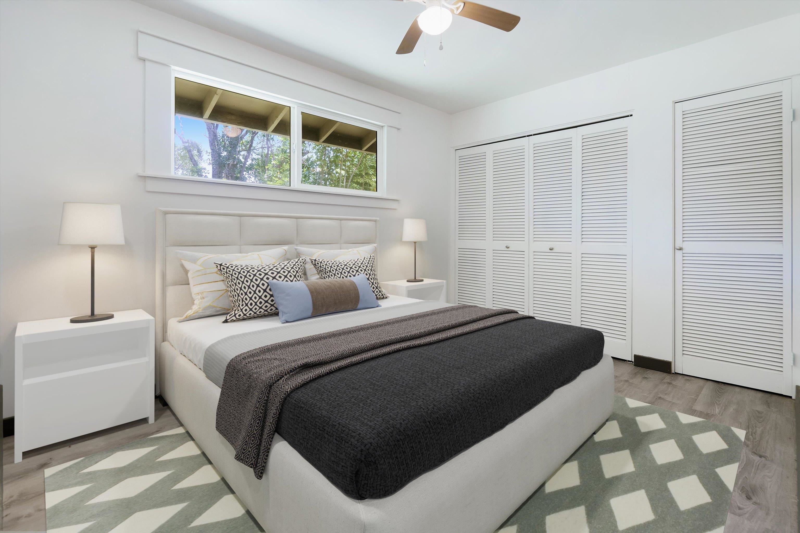 605 Kaupakalua Road Haiku, HI 96708 - Photo 41 of 44 a bedroom with a bed and a painting on the wall