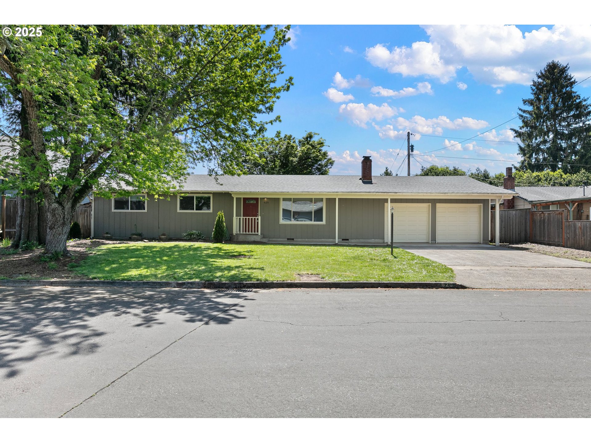 a front view of house with yard and green space