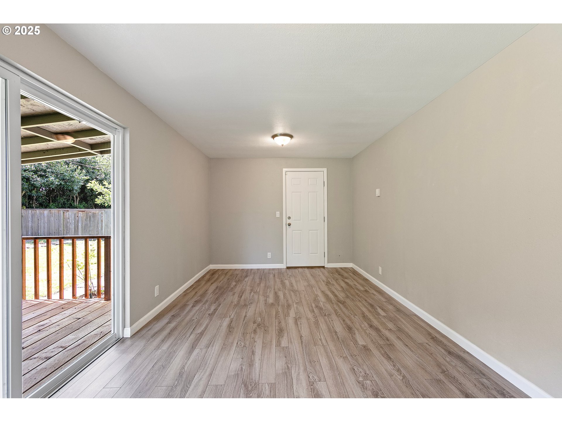 620 Nottingham Avenue Eugene, OR 97404 - Photo 14 of 36 a view of an empty room and wooden floor