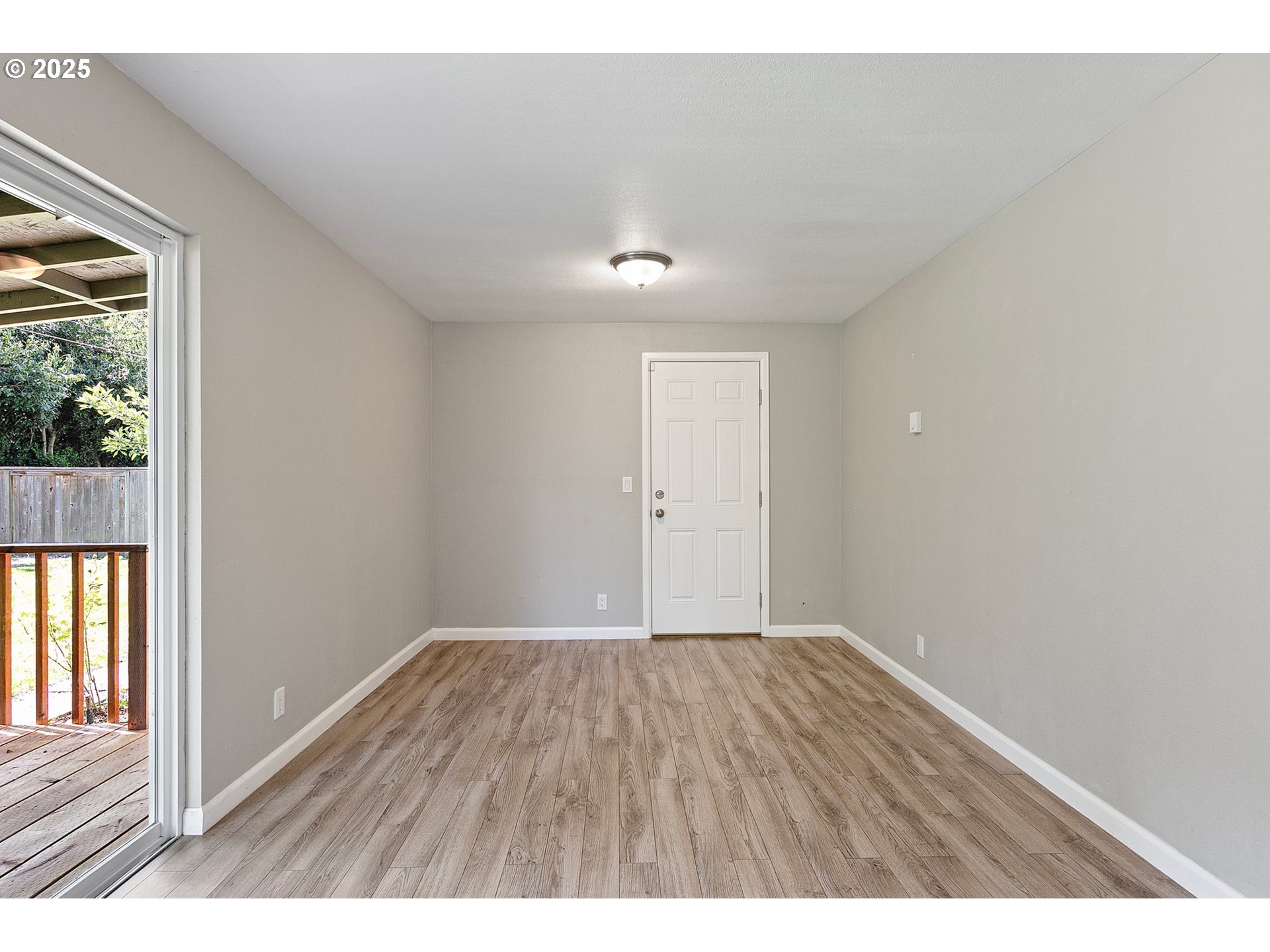 620 Nottingham Avenue Eugene, OR 97404 - Photo 15 of 36 a view of an empty room with wooden floor