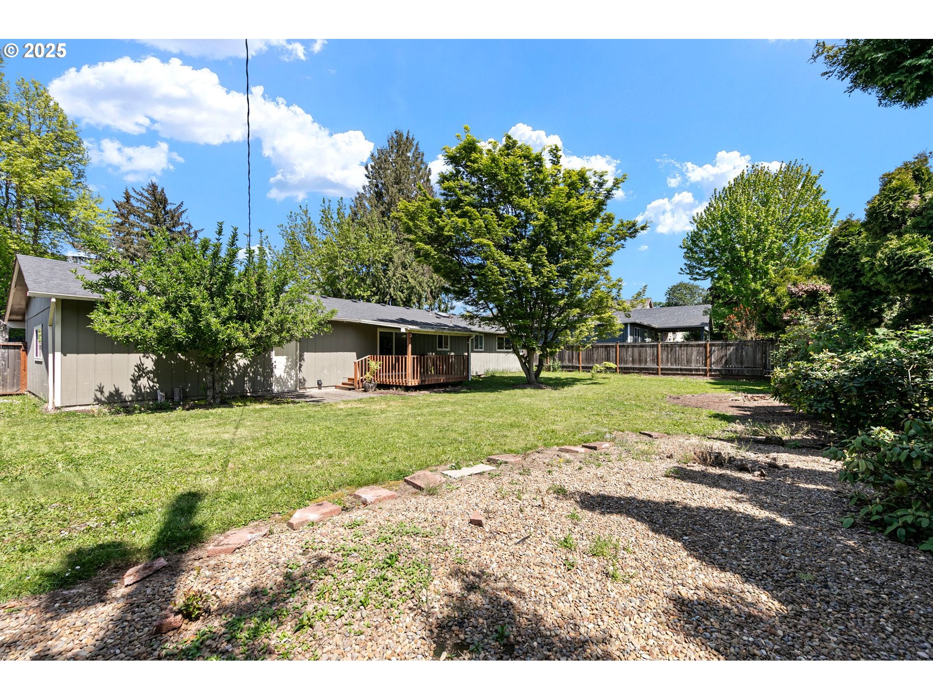 620 Nottingham Avenue Eugene, OR 97404 - Photo 33 of 36 a view of a house with a yard