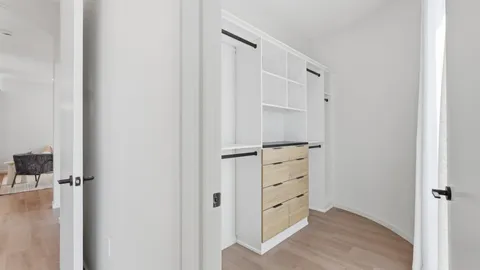 an empty room with wooden floor