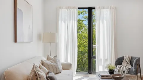 a living room with furniture and a window