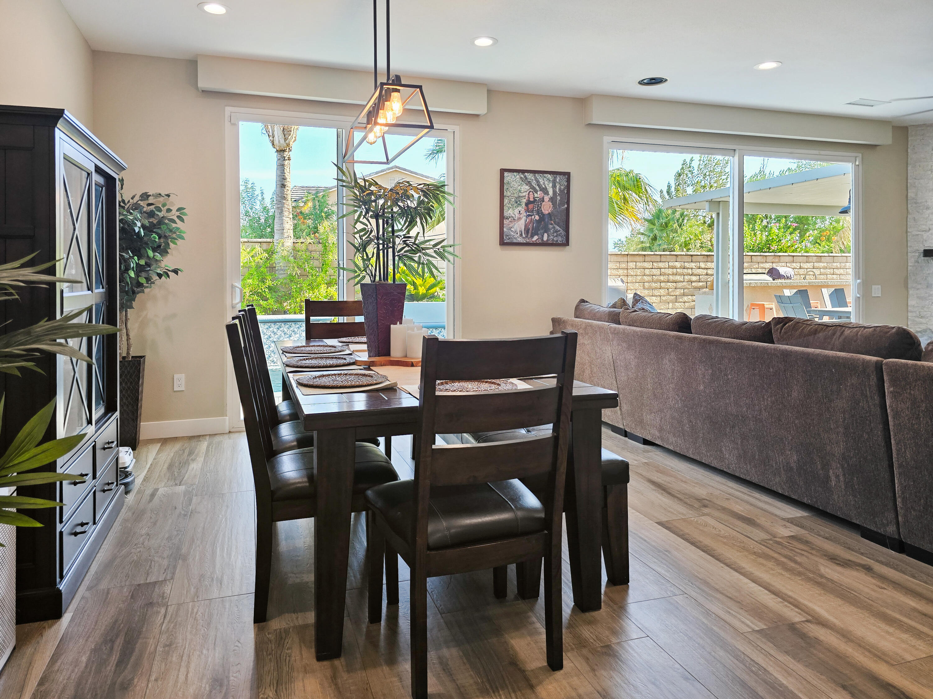80501 Denton Drive Indio, CA 92203 - Photo 16 of 42 a view of a dining room with furniture window and wooden floor