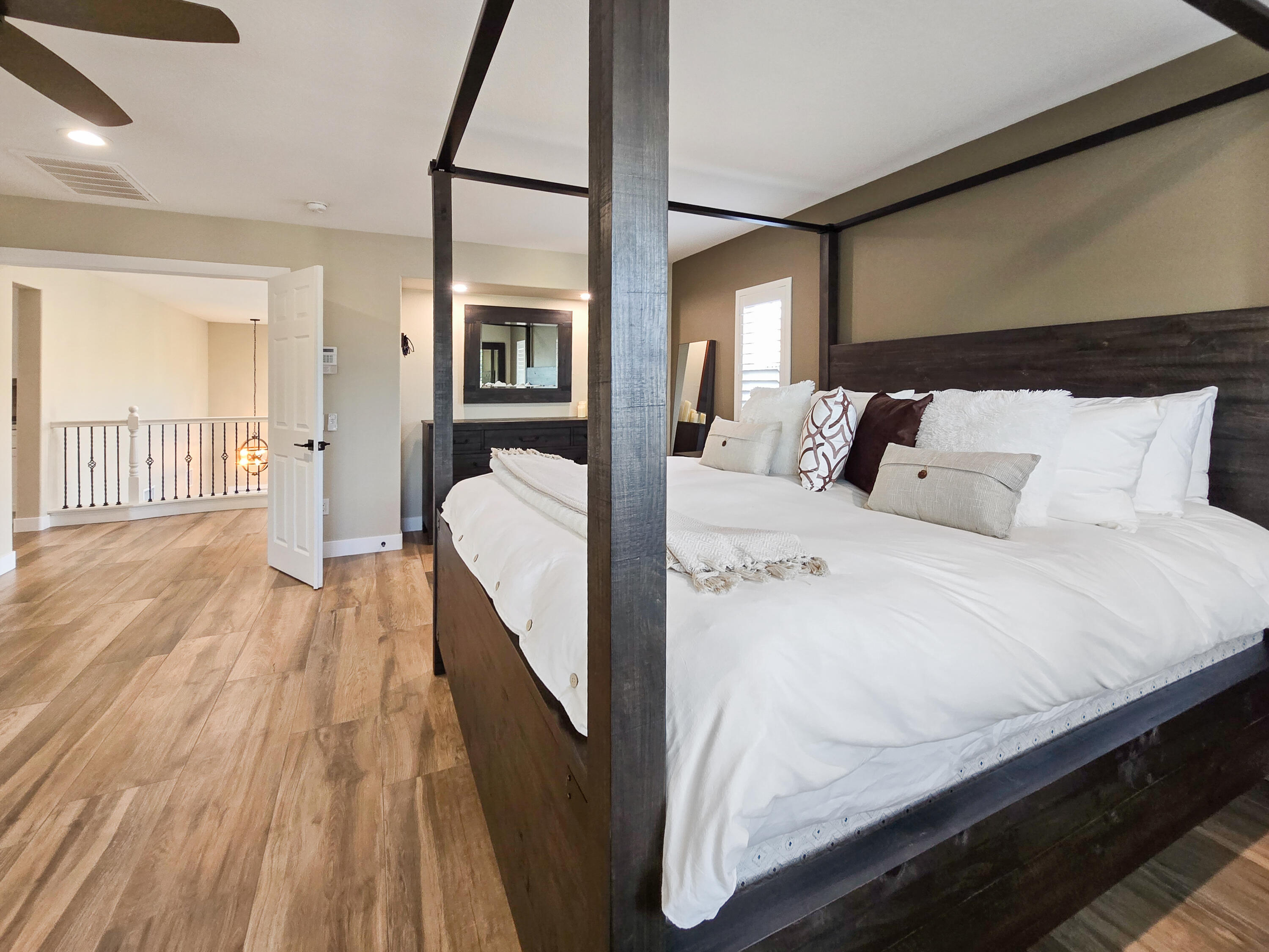 80501 Denton Drive Indio, CA 92203 - Photo 19 of 42 a bed room with a bed and a wooden floor