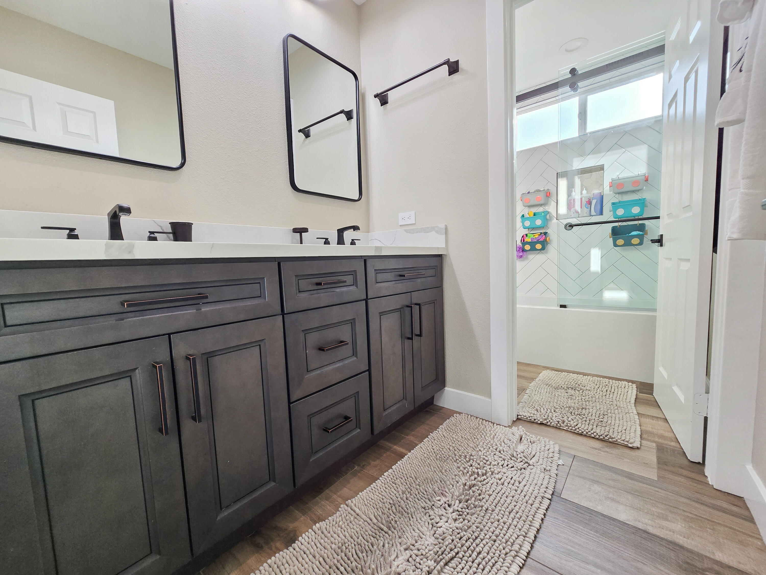 80501 Denton Drive Indio, CA 92203 - Photo 30 of 42 a spacious bathroom with a granite countertop sink mirror and shower