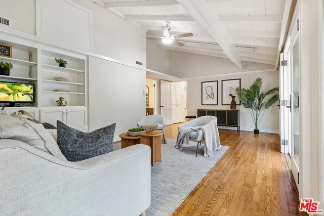 a kitchen with a sink a stove cabinets and counter space