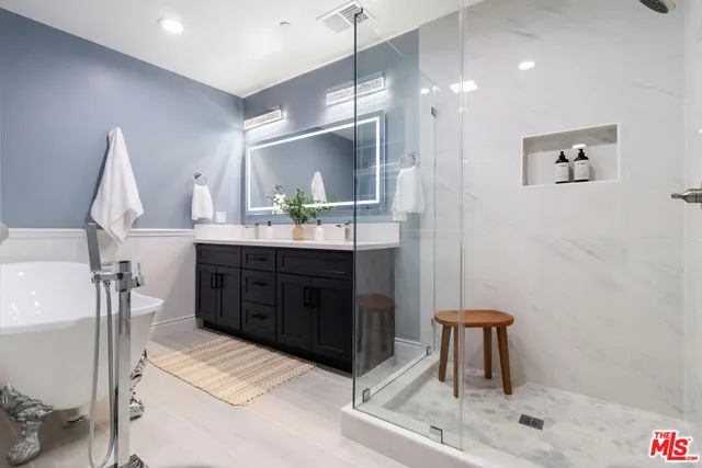 a white bath tub sitting next to a window