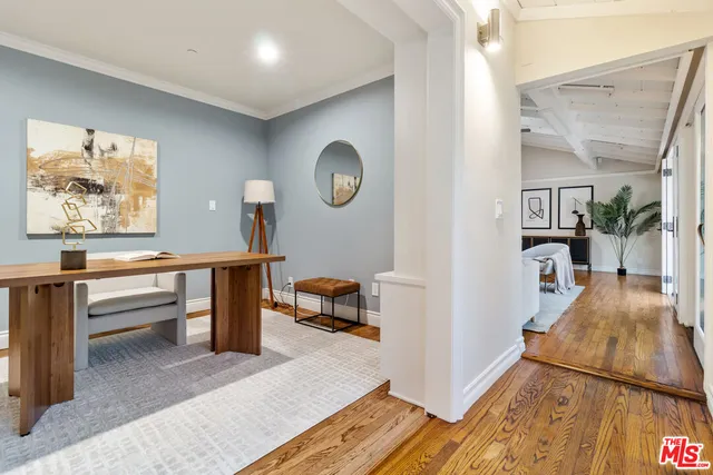 a workspace with furniture window and wooden floor