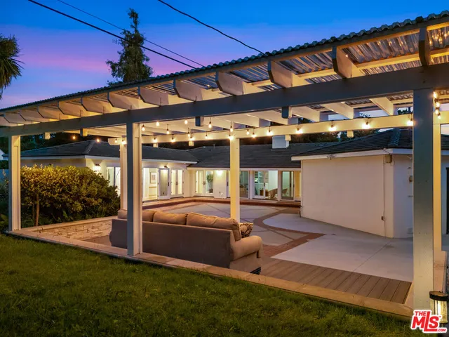 a view of an chairs in a backyard