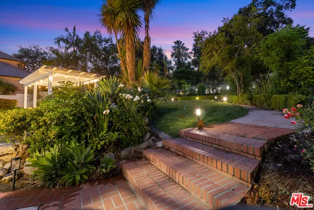 a view of a house with a garden