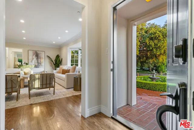 a living room with furniture fireplace and window