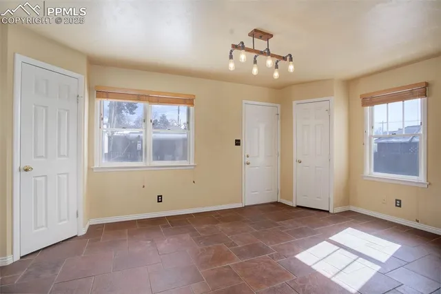 a view of an empty room with a window