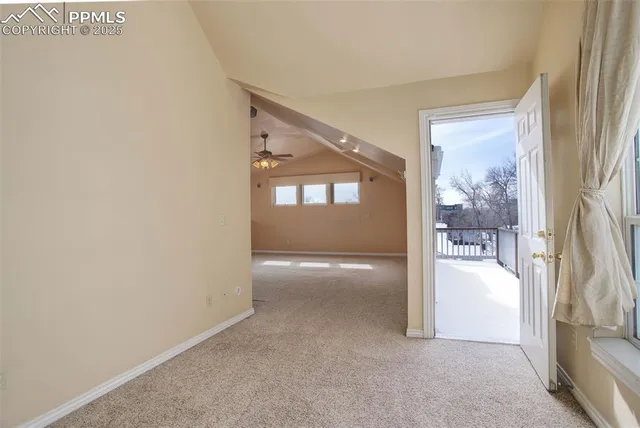a view of balcony with wooden floor and fence