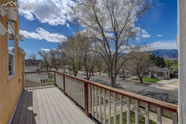 a view of a balcony with wooden floor