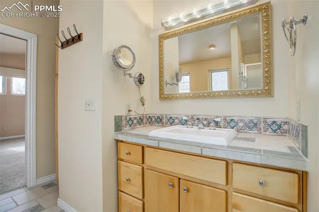 a bath tub sitting in a bathroom next to a window
