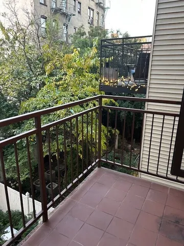 a view of balcony with a potted plant
