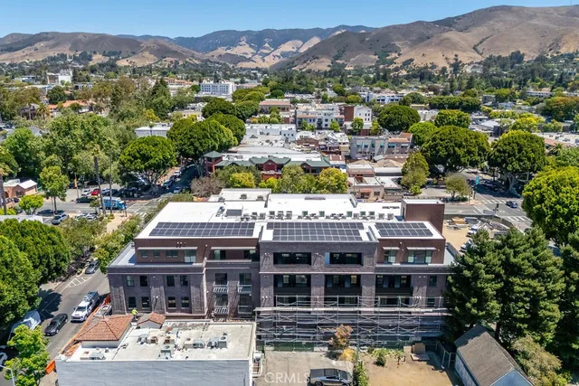 an aerial view of residential houses and lake view