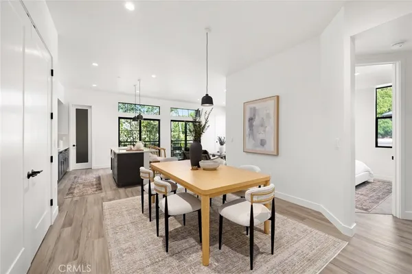 a kitchen with a sink window and cabinets