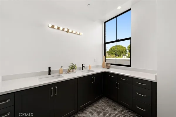a bedroom with a bed and a mirror