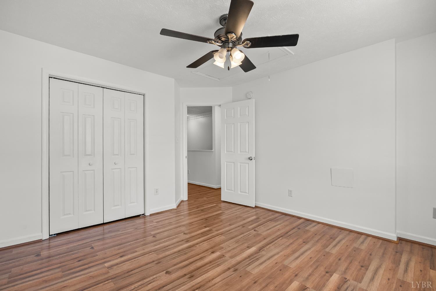 300 McConville Road, Unit 63 Lynchburg, VA 24502 - Photo 27 of 37 a view of an empty room with wooden floor