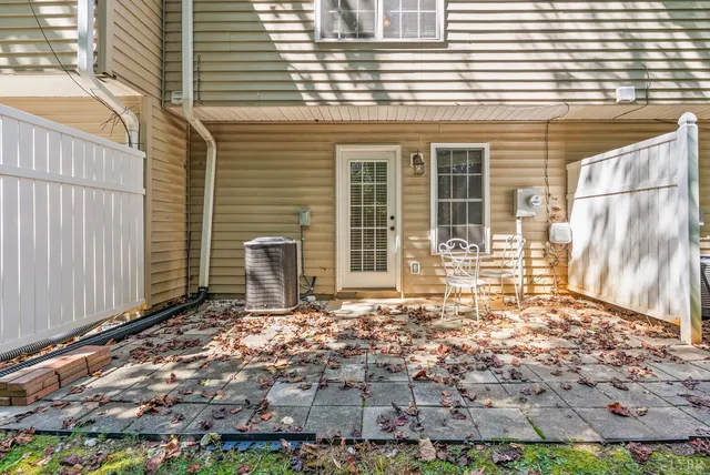 an aerial view of a house with a yard basket ball court and outdoor seating
